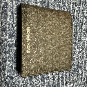 Brand new never used MK mens wallet.